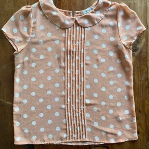 Peach blouse with white polka dots